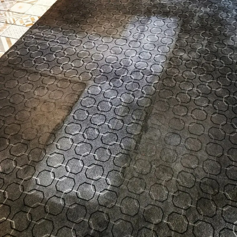 Overhead view of patterned commercial carpet, before and after cleaning