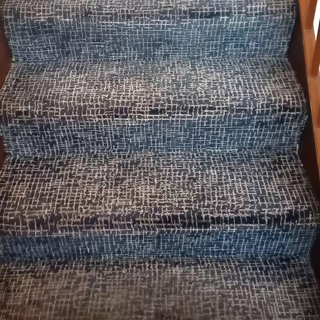 A patterned stair carpet after cleaning, each tread done by hand