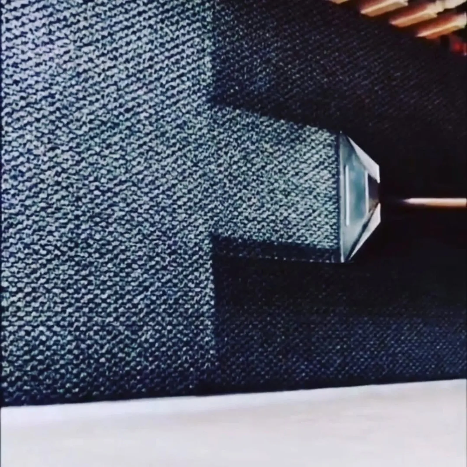 Real carpet cleaning in progress, steam-cleaning wand on a commercial carpet