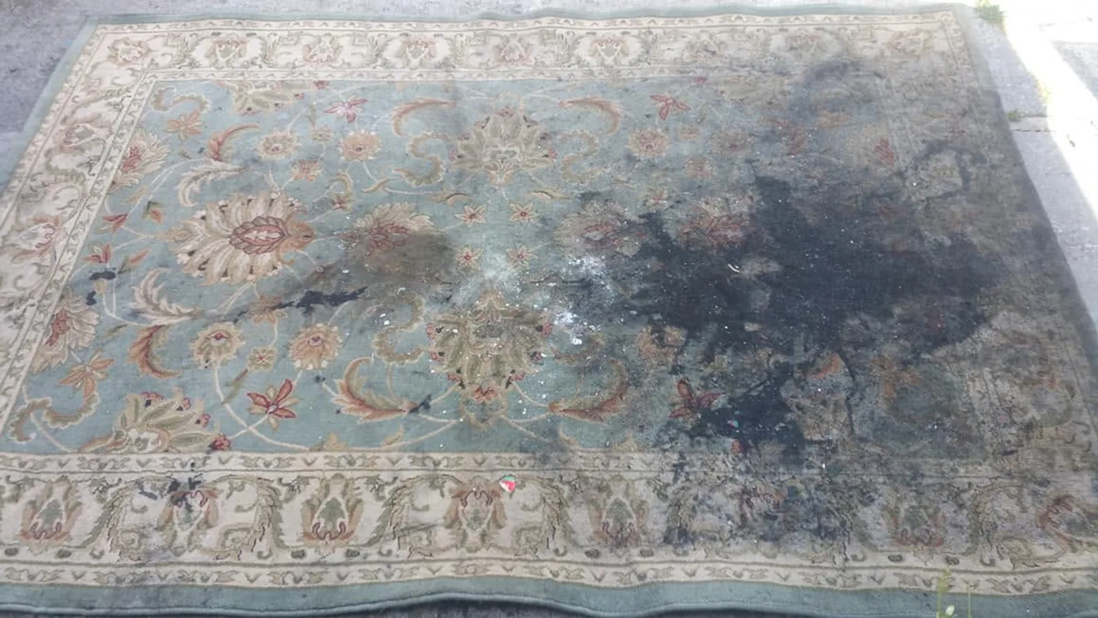 Area rug before cleaning, heavily soiled